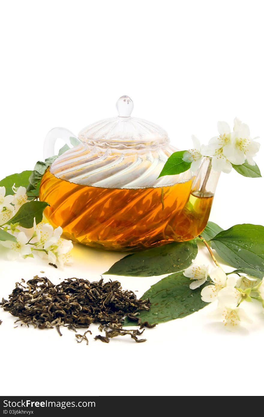 Green tea with fresh jasmine leaves and flowers on white background. Green tea with fresh jasmine leaves and flowers on white background