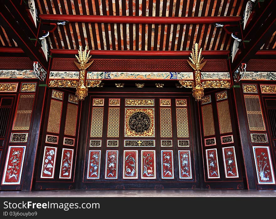 Ancient Chinese Golden Sliding Doors with wooden ceiling, Khoo Kongsi, Pulau Pinang, Malaysia. Ancient Chinese Golden Sliding Doors with wooden ceiling, Khoo Kongsi, Pulau Pinang, Malaysia