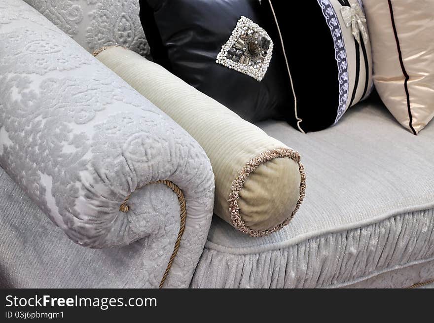 A flowery style sofa and pillow, shown as home interior and comfortable life. A flowery style sofa and pillow, shown as home interior and comfortable life.