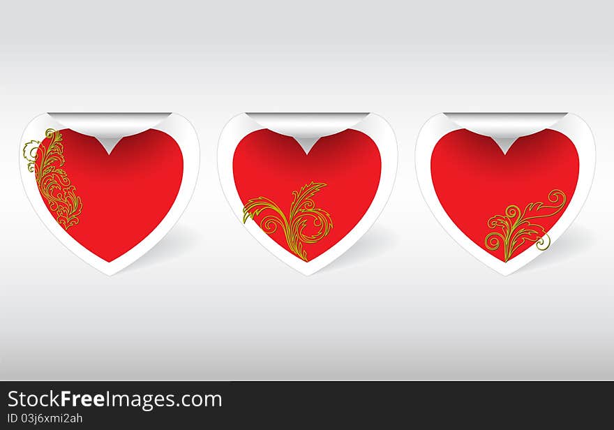 Three swirl sticker in the shape of hearts with golden ornaments. Three swirl sticker in the shape of hearts with golden ornaments