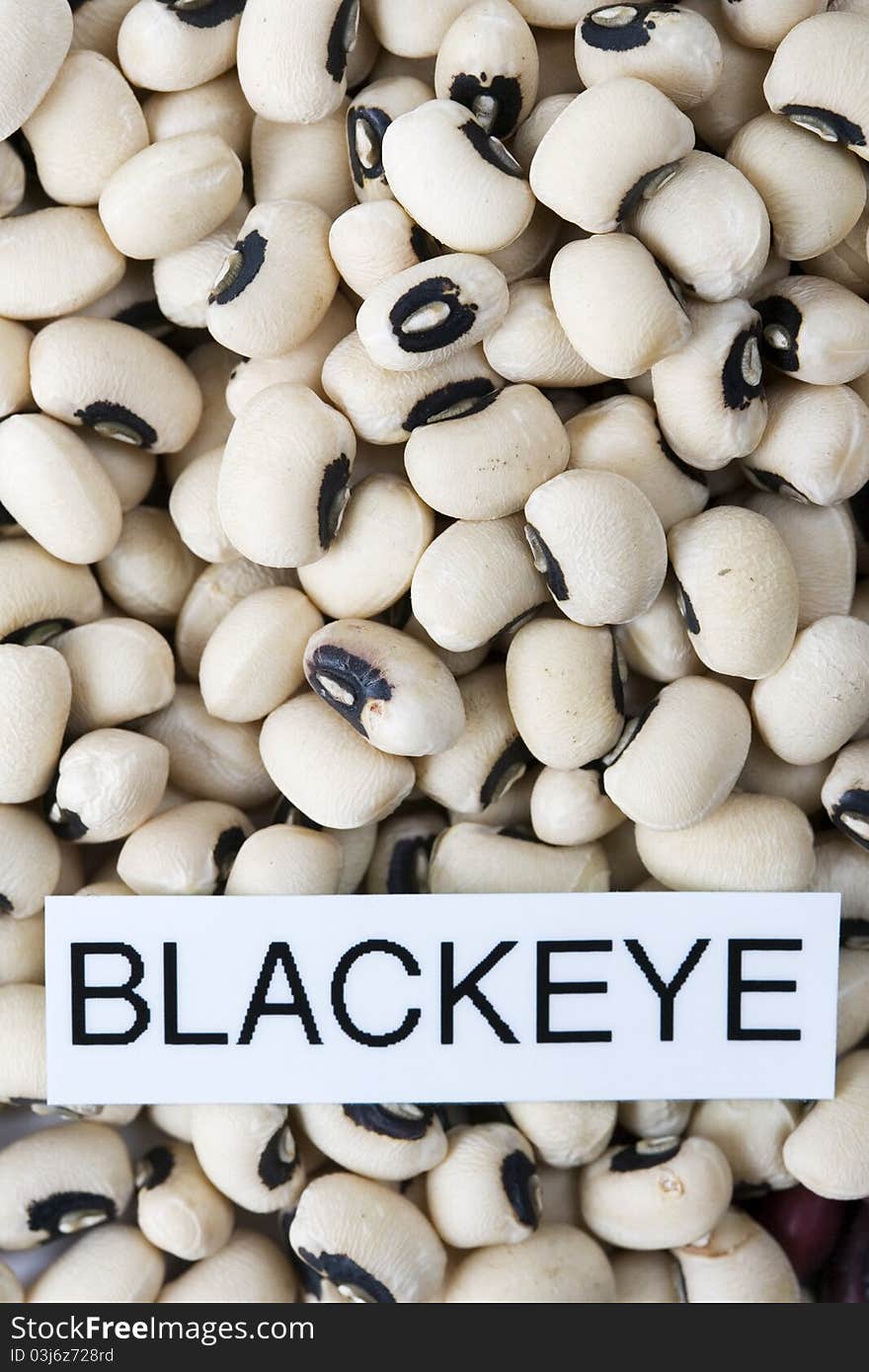 Dried black eyed beans with label close-up macro background