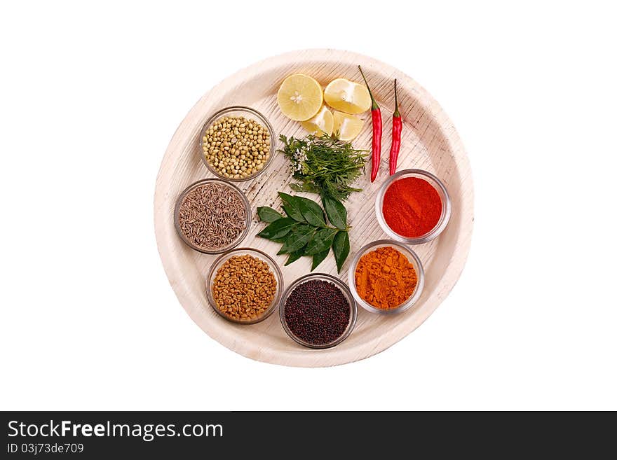 Indian kitchen spices and herbs on a plate. Indian kitchen spices and herbs on a plate