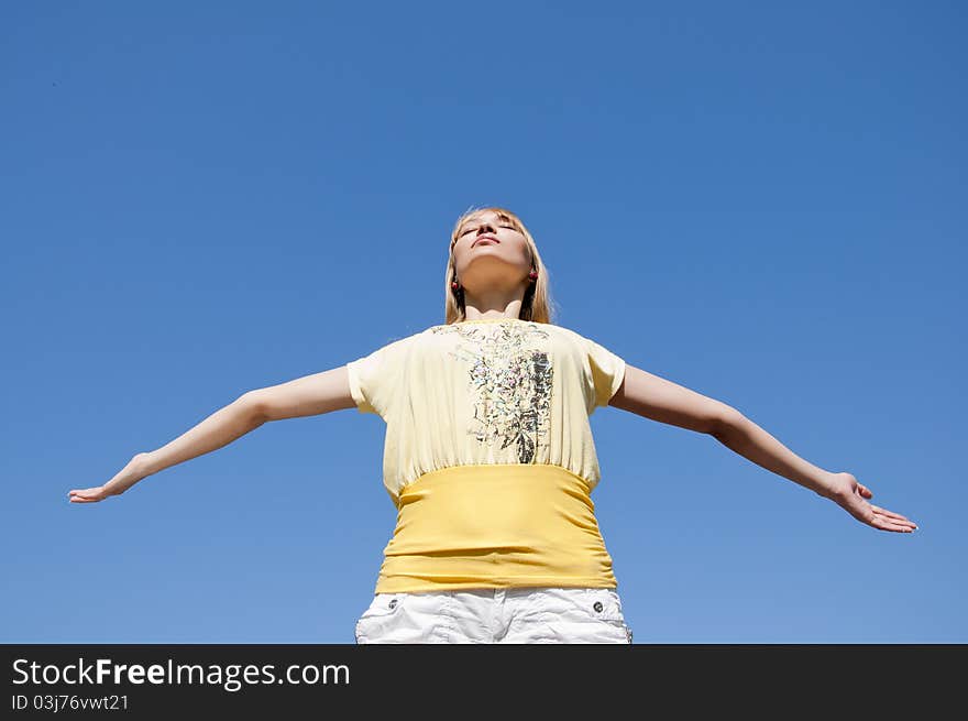 Woman Having Stretched Hands Aspires In The Sky