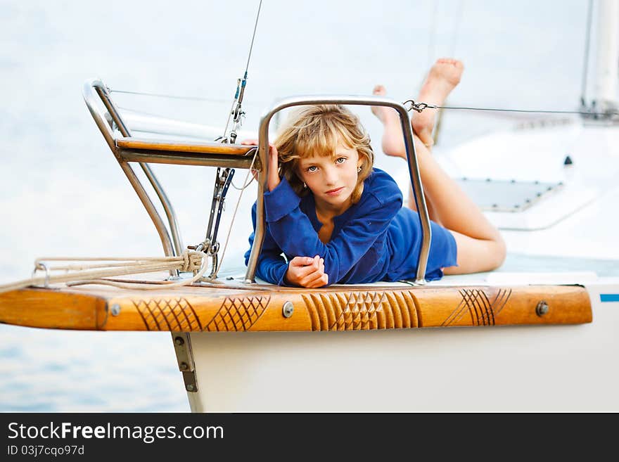 Playful pretty little girl on sail boat. Playful pretty little girl on sail boat