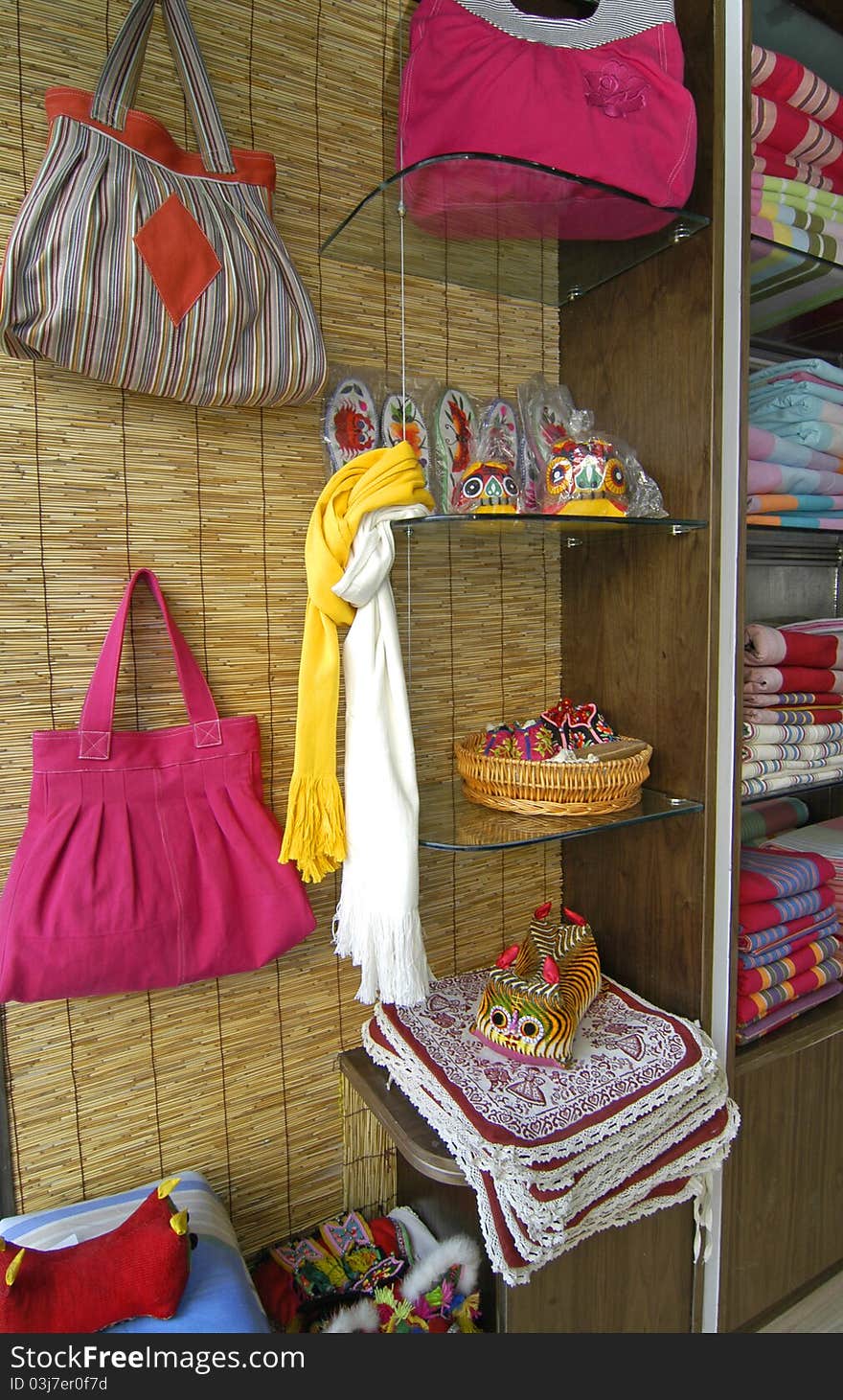 Hand bags made of cloth and accessories hanging in the store. Hand bags made of cloth and accessories hanging in the store