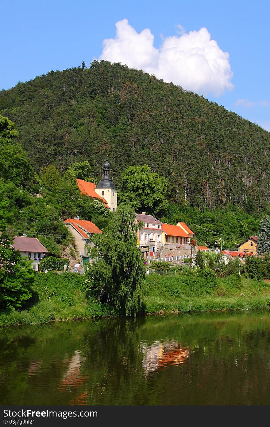 Few buildings of small village by the river under the hill. Few buildings of small village by the river under the hill