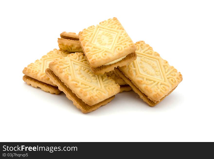 Pile of cream filled biscuits over white