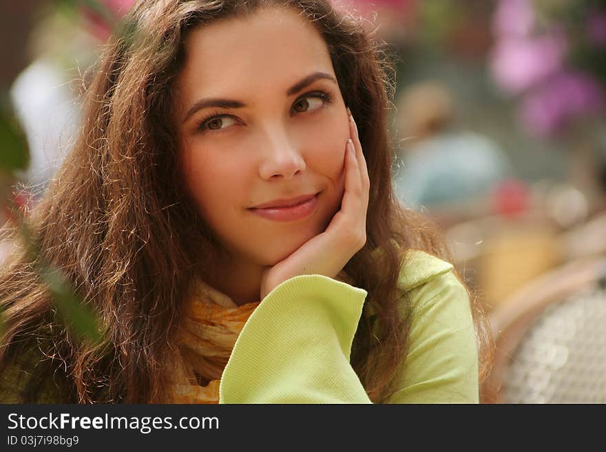 Attractive young woman relaxing outdoors. Attractive young woman relaxing outdoors