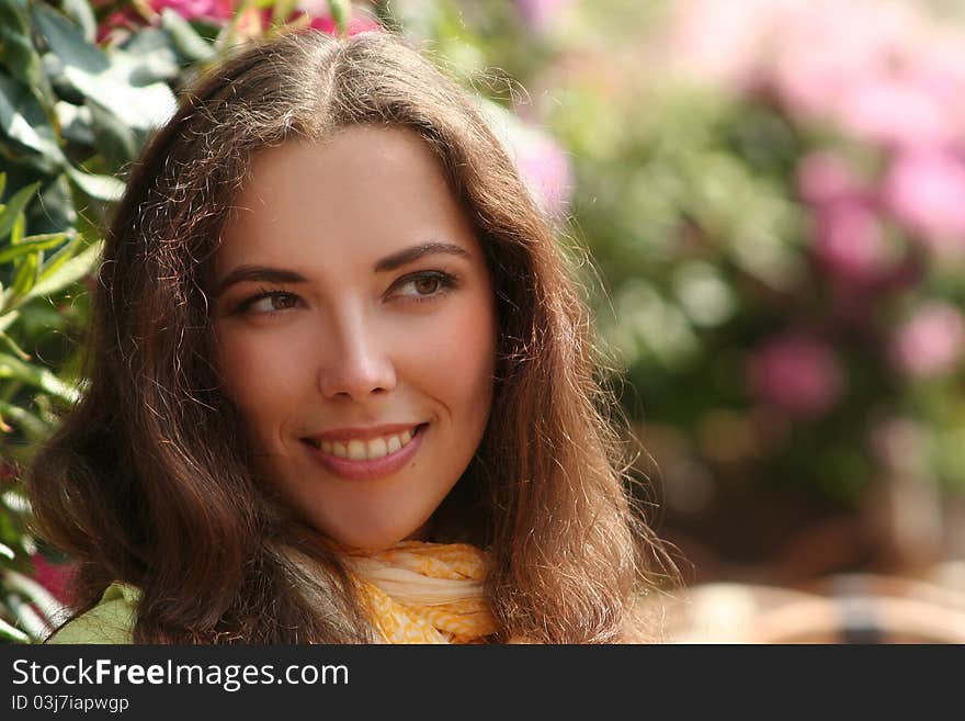 Attractive young woman relaxing outdoors. Attractive young woman relaxing outdoors