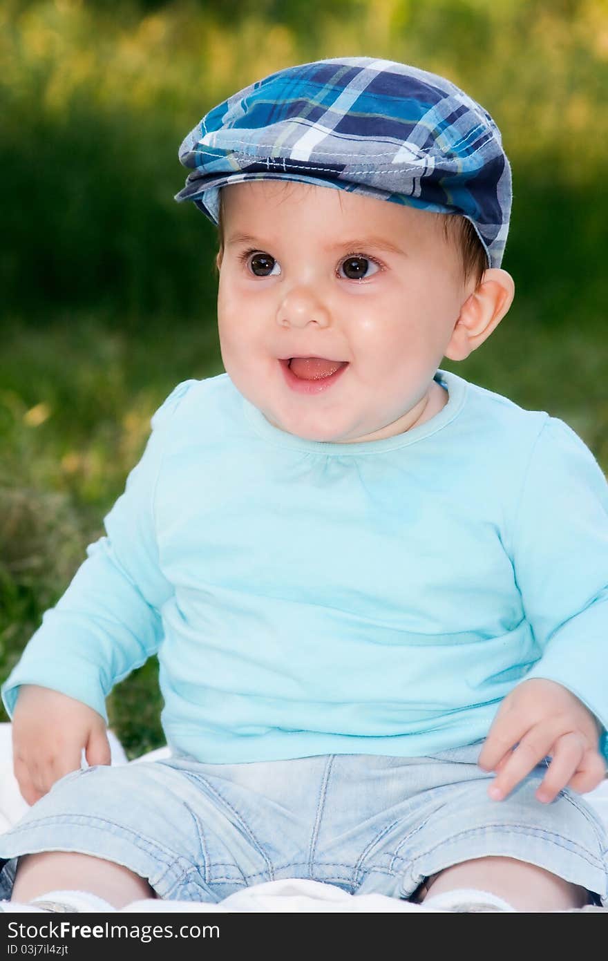 Cute little baby boy portrait outdoors