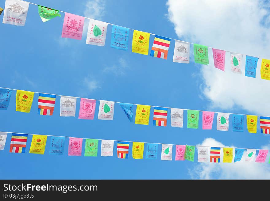 Rows Of Colorful Flags Fluttering In Celebration Of Vesak Day. Rows Of Colorful Flags Fluttering In Celebration Of Vesak Day