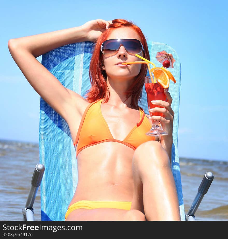 Young woman relaxing on beach. Young woman relaxing on beach