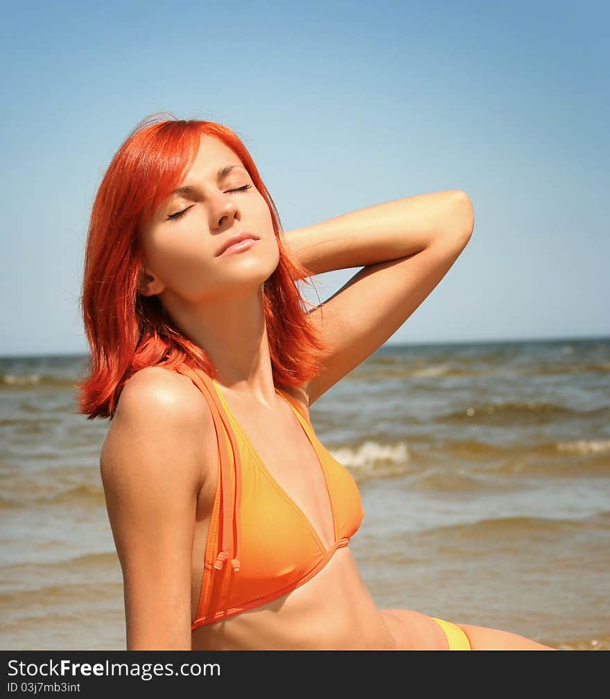 Young woman relaxing on beach. Young woman relaxing on beach