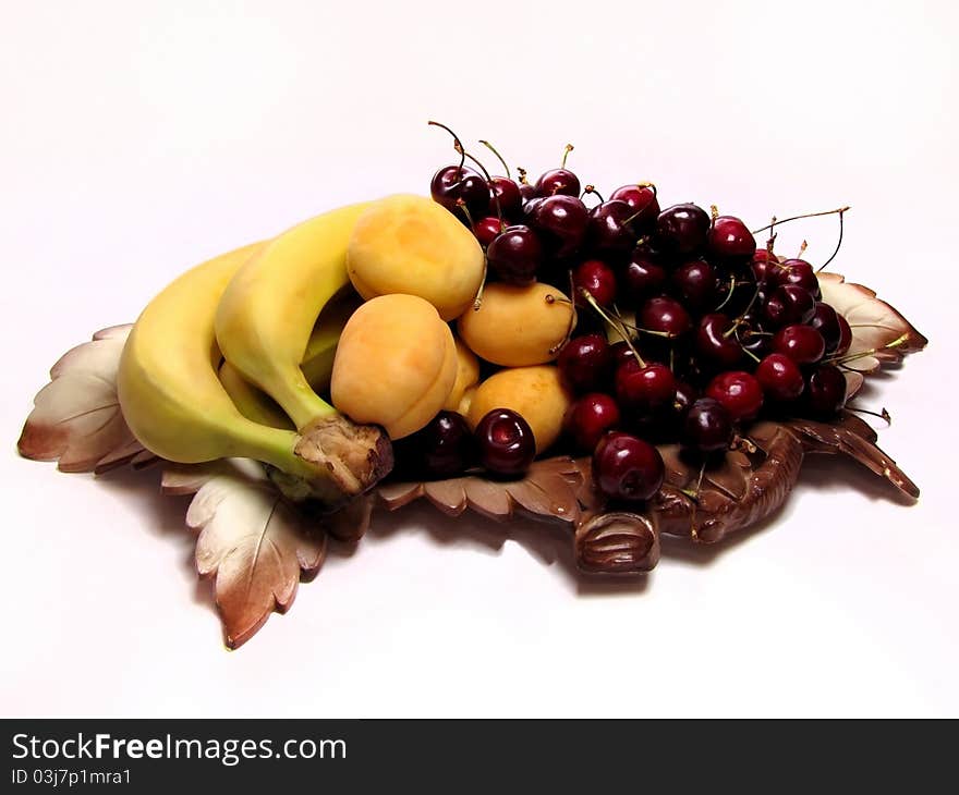 Fruits on a dish in the form of grape leaves