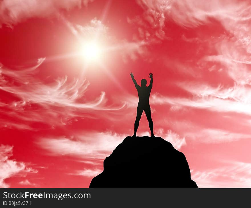 Silhouette of a man at the top of the mountain against the sky