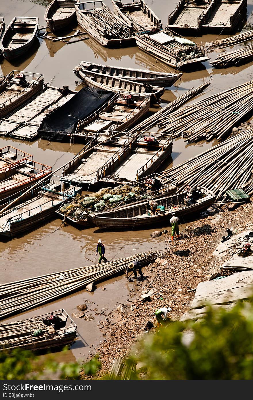 Some fishermen are busy preparing some tools for fishing. Some fishermen are busy preparing some tools for fishing.