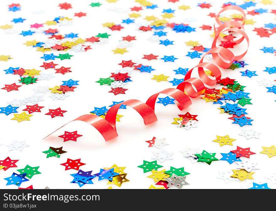 Red party decoration and confetti isolated on white background