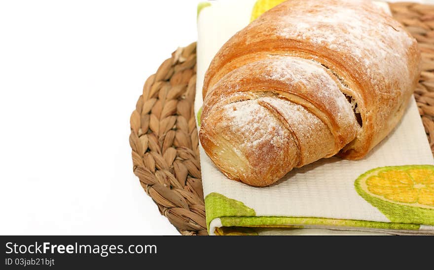 Croissant dusted with icing sugar. Croissant dusted with icing sugar