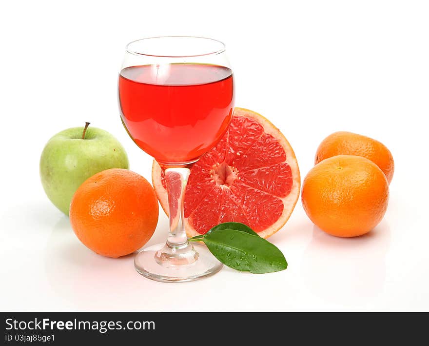 Fresh fruit and juice on a white background