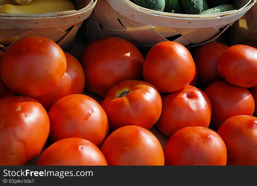 Tomatoes for sale at a local farmers market. Tomatoes for sale at a local farmers market