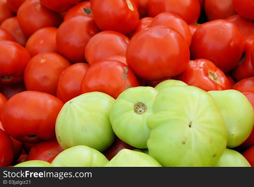 Tomatoes for sale at a local farmers market. Tomatoes for sale at a local farmers market