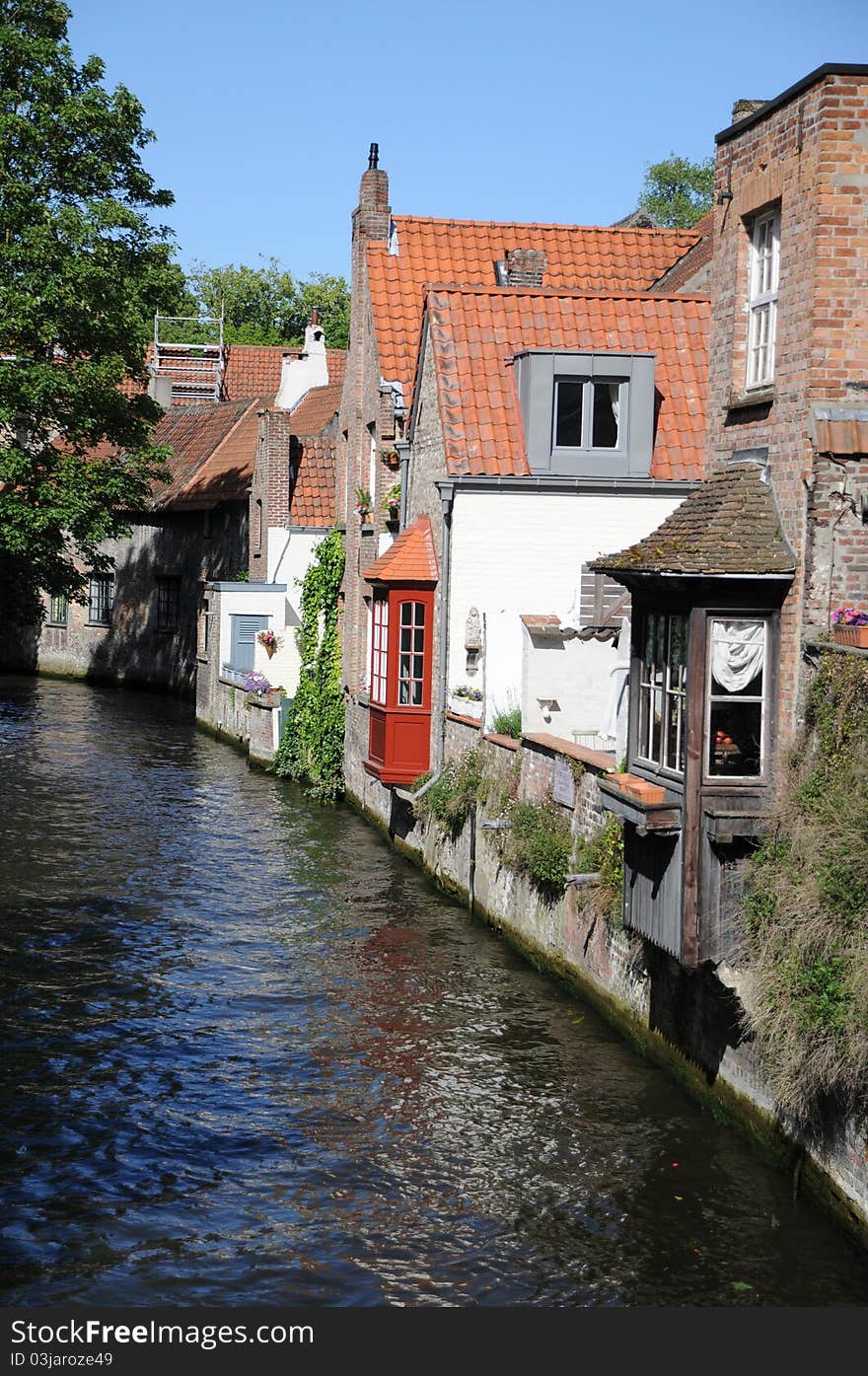 Houses in Bruges standing by a canal. Houses in Bruges standing by a canal