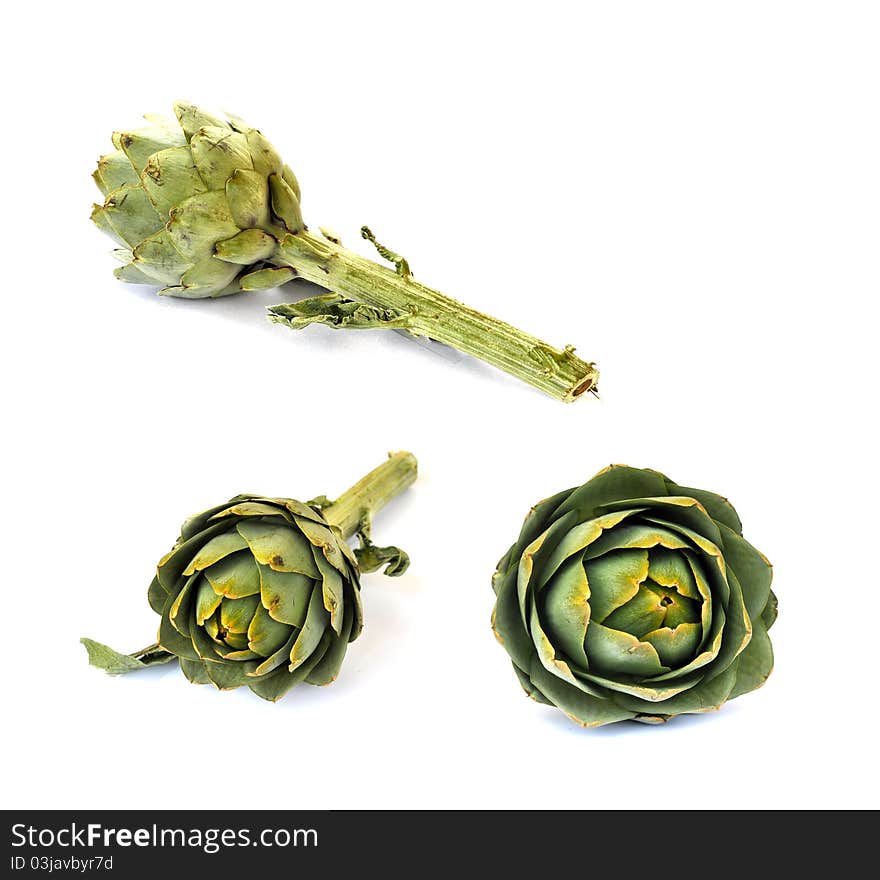 A single artichoke in three different views. A single artichoke in three different views