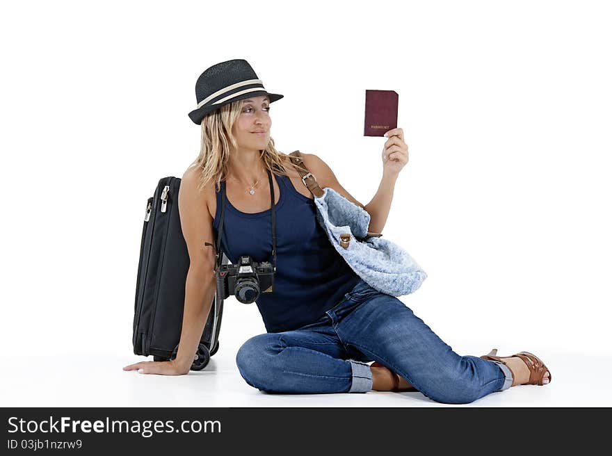 Tourist woman traveling with her passport, luggage, and a camera. Tourist woman traveling with her passport, luggage, and a camera