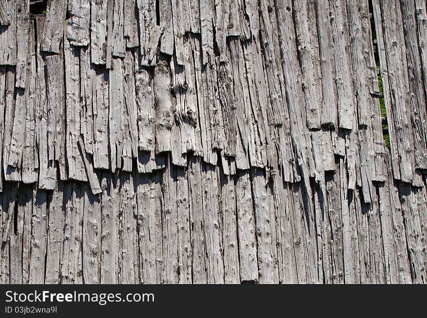 An old and damaged wood roof. An old and damaged wood roof