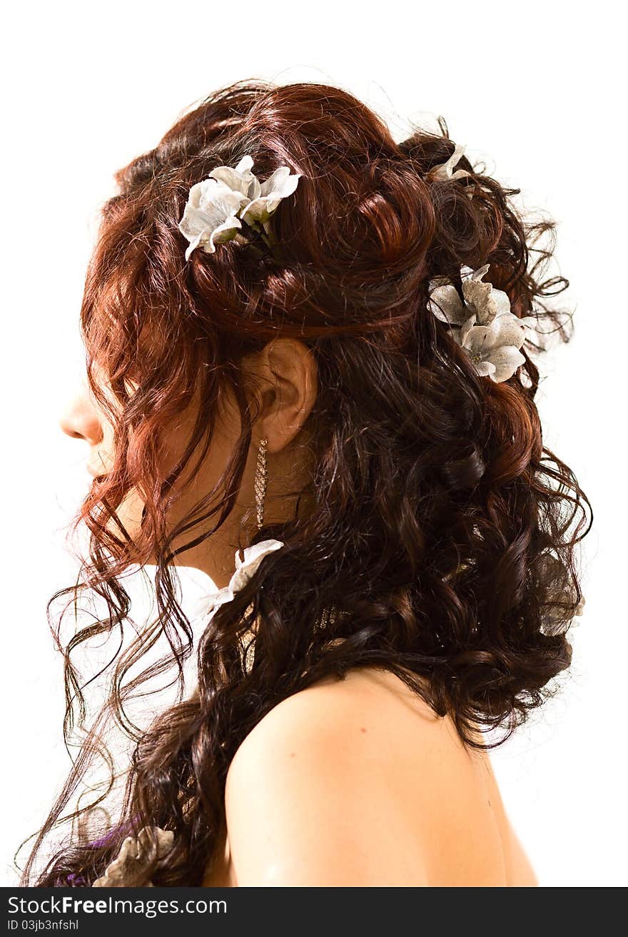 The young girl with a beautiful hairdress on a white background. The young girl with a beautiful hairdress on a white background.