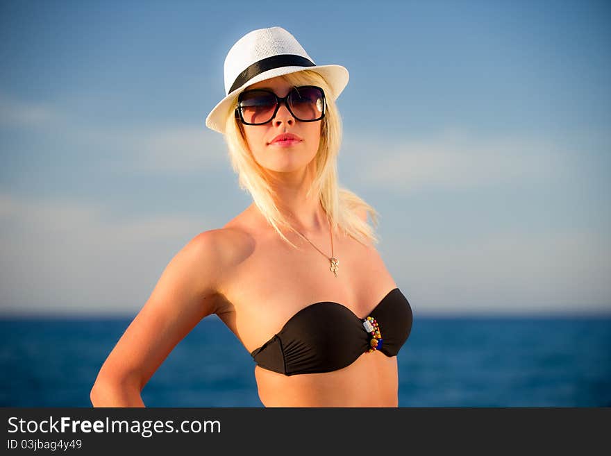 The Girl In A Hat And Bikinis