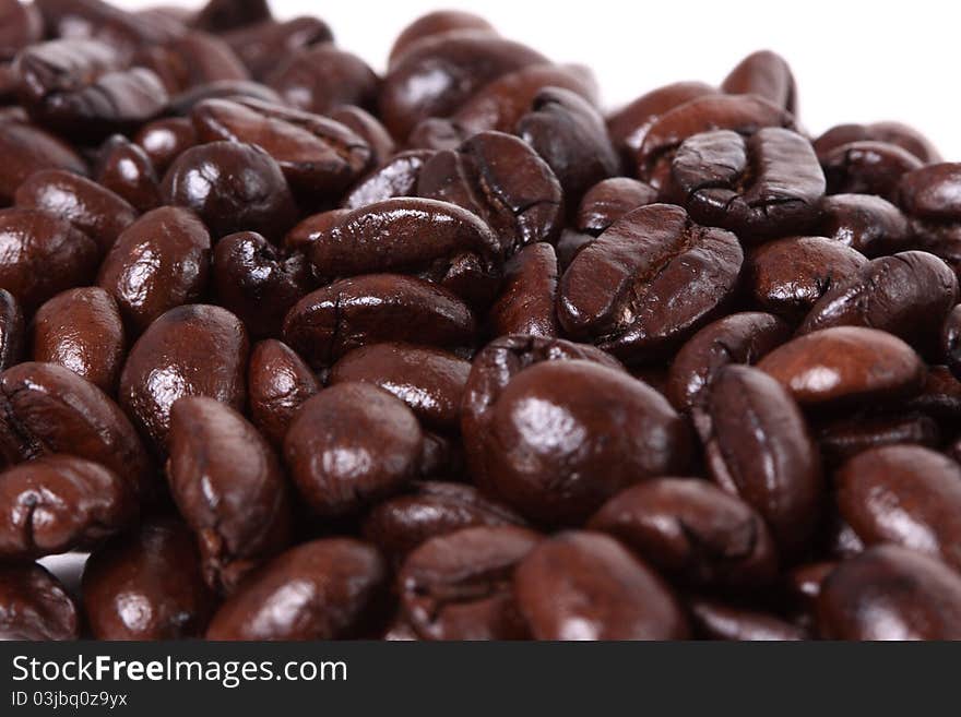 An arrangement of coffee beans on a white background