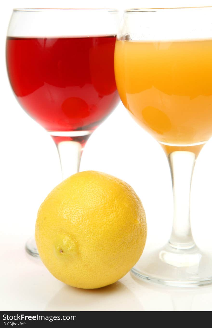 Fresh fruit and juice on a white background