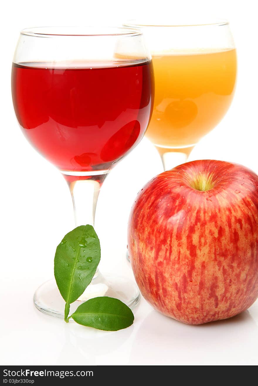 Fresh fruit and juice on a white background