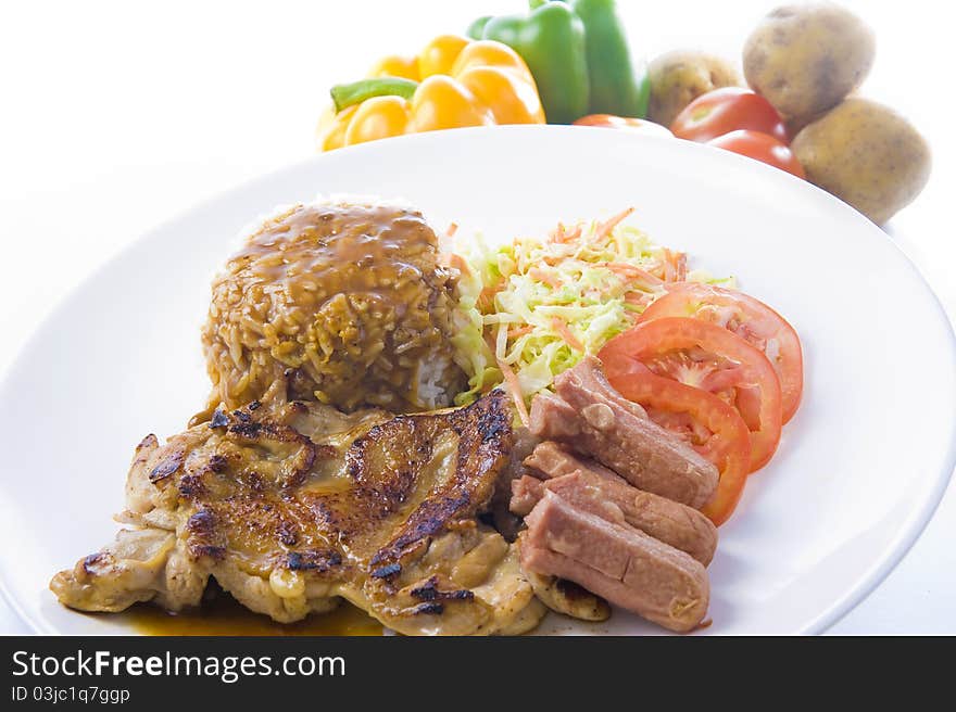 A plate of black peppered chicken chop with rice ready to be served, a western delicacy in most countries. A plate of black peppered chicken chop with rice ready to be served, a western delicacy in most countries.