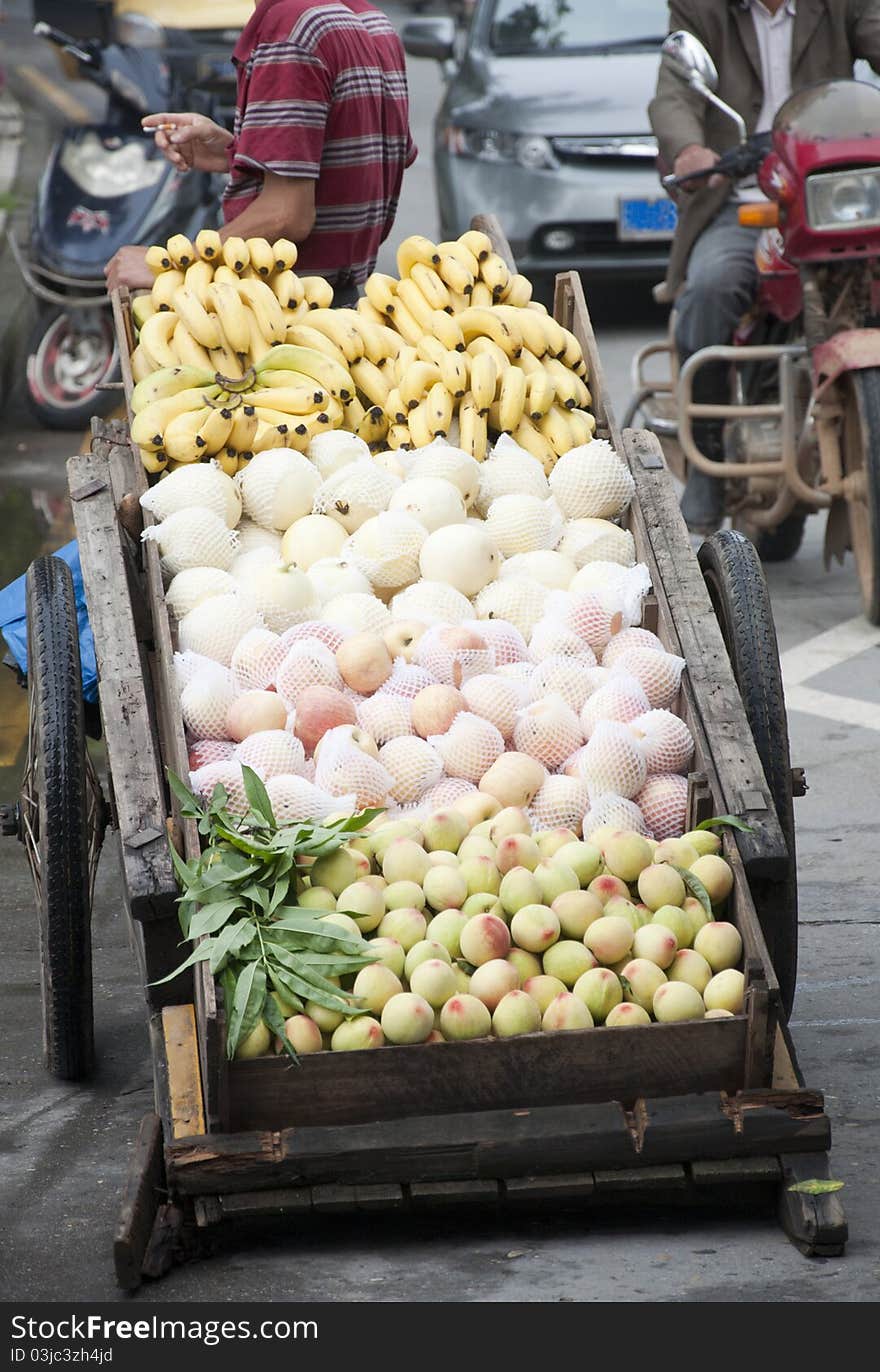 Asian fruit hawkers,street pedlar