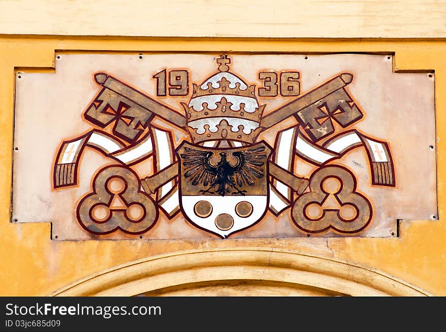 The coat of arms outside the Wambierzyce Basilica in Poland.