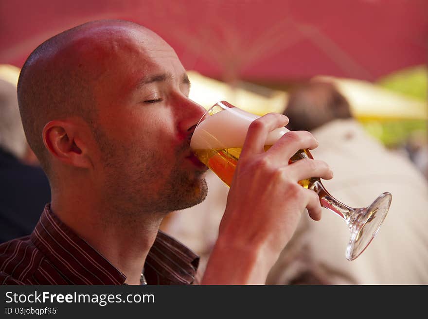 Young man drinking a beer. Young man drinking a beer