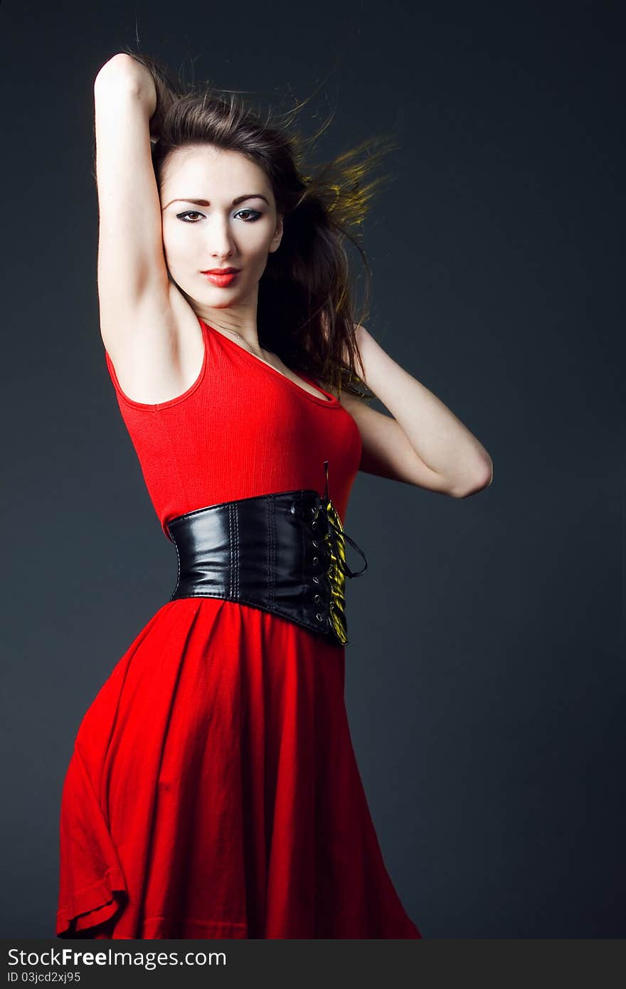 Young sexy woman in a red dress