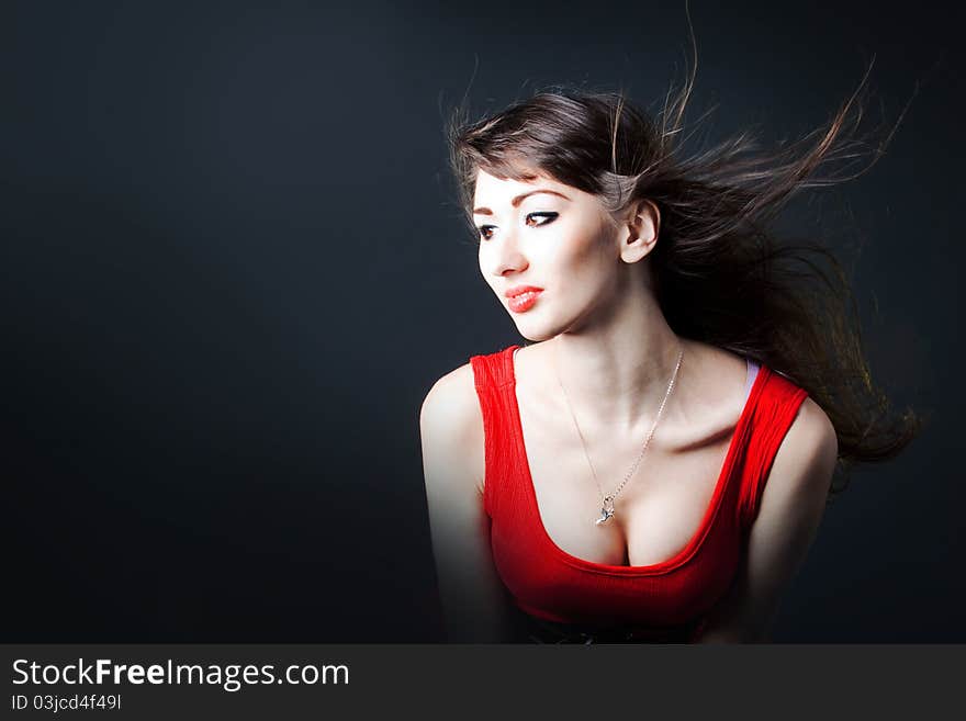 Young sexy woman in a red dress