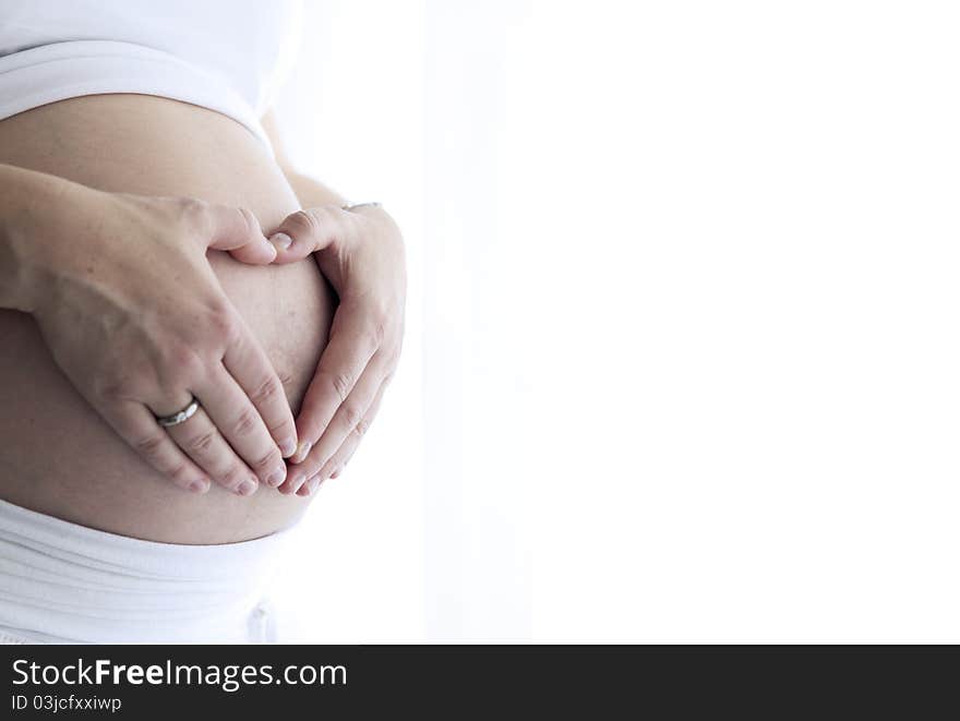 Shot of a pregnant woman and her belly