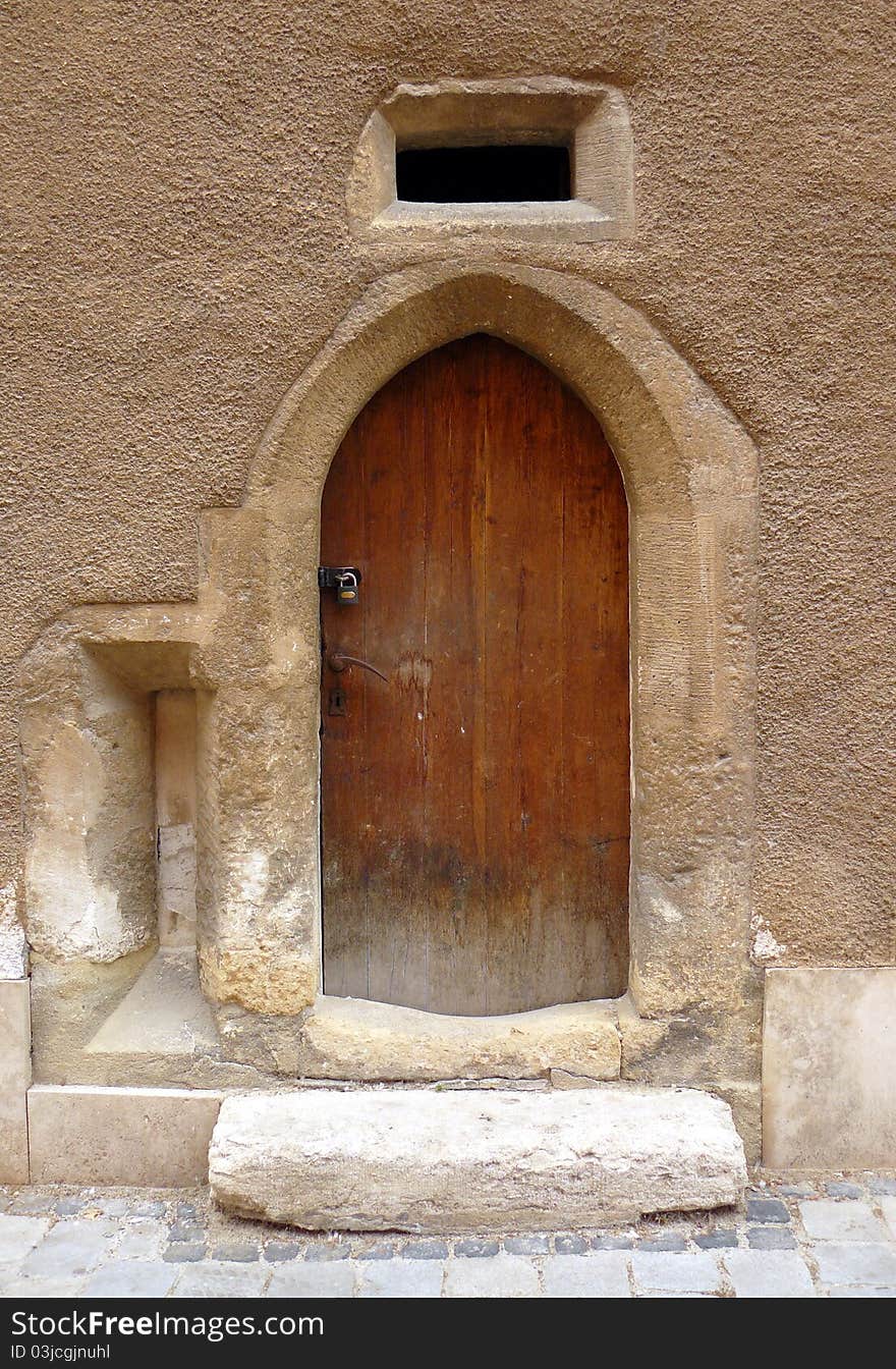 Small old door in an ancient hungarian street.