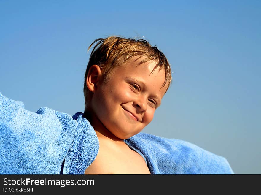 Portrait of cute boy at the beach