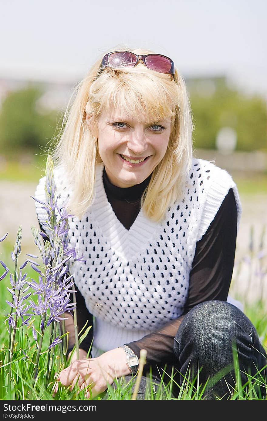 Portrait of a blond young woman on a spring day. Portrait of a blond young woman on a spring day