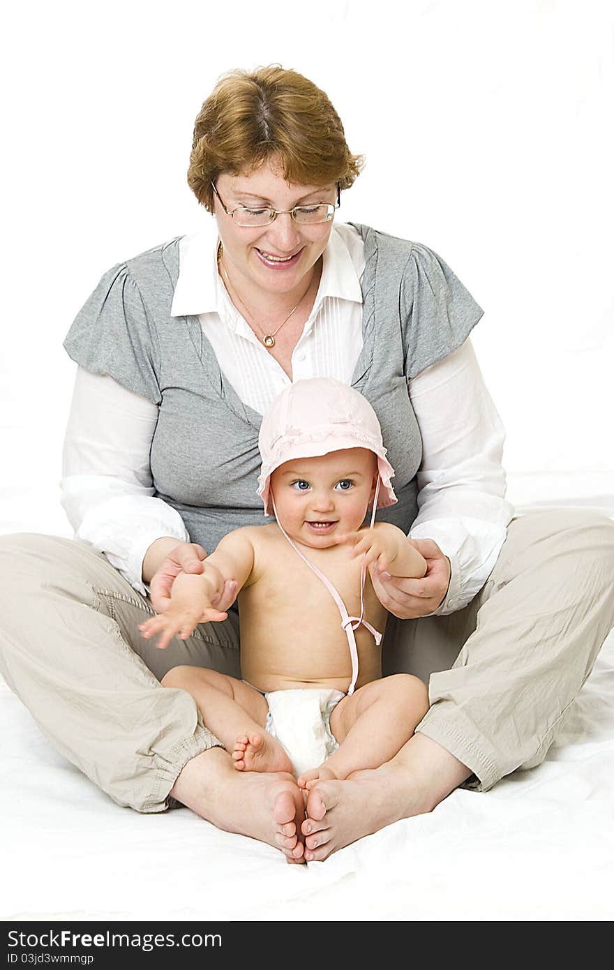 Happy mother and her baby girl in studio. Happy mother and her baby girl in studio