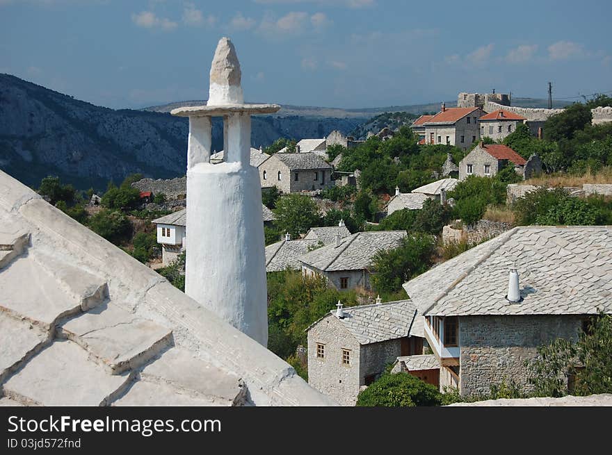 A photograph across the rooftops of Pocitelj, Bosnia and Herzegovina