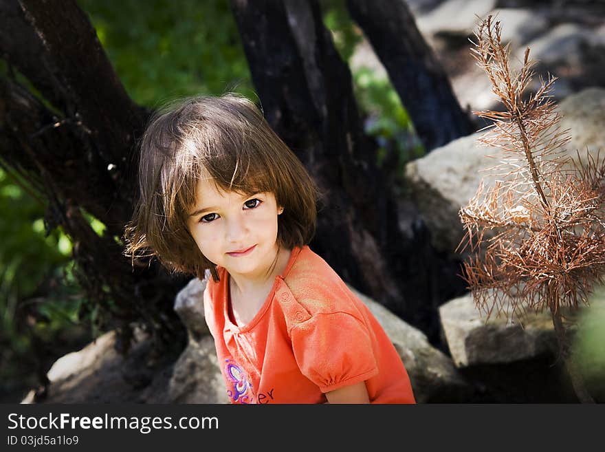 Portrait of a little girl in the garden