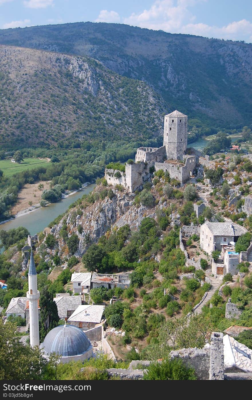 A photograph Pocitelj Town on the Capljina River with mosque nd castle , Bosnia and Herzegovina