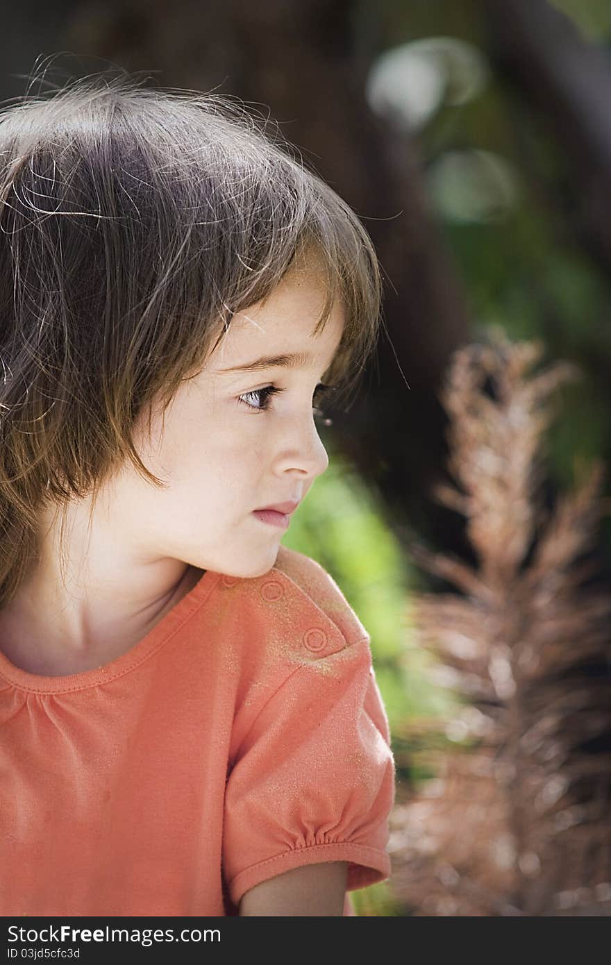 Portrait of a little girl in the garden