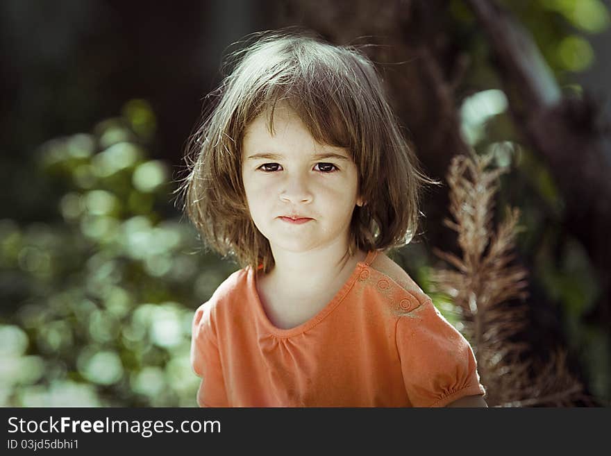 Portrait of a little girl in the garden